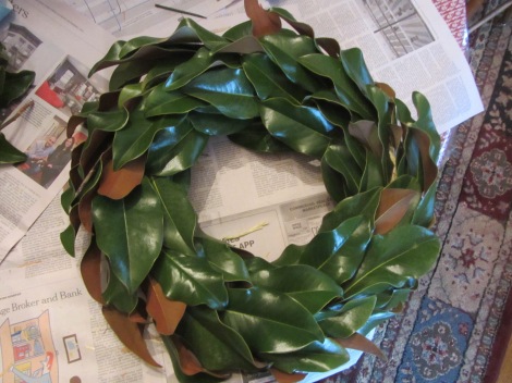 When you are finished (this took me a little over an hour to do) examine the wreath for places where the straw is showing through.  There's a little place at about 2:00 o'clock so I wrap one more leaf to cover that.