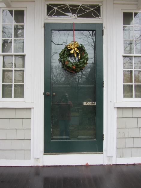 The finished wreath.  I used a gold bow so it would show up against our green door.